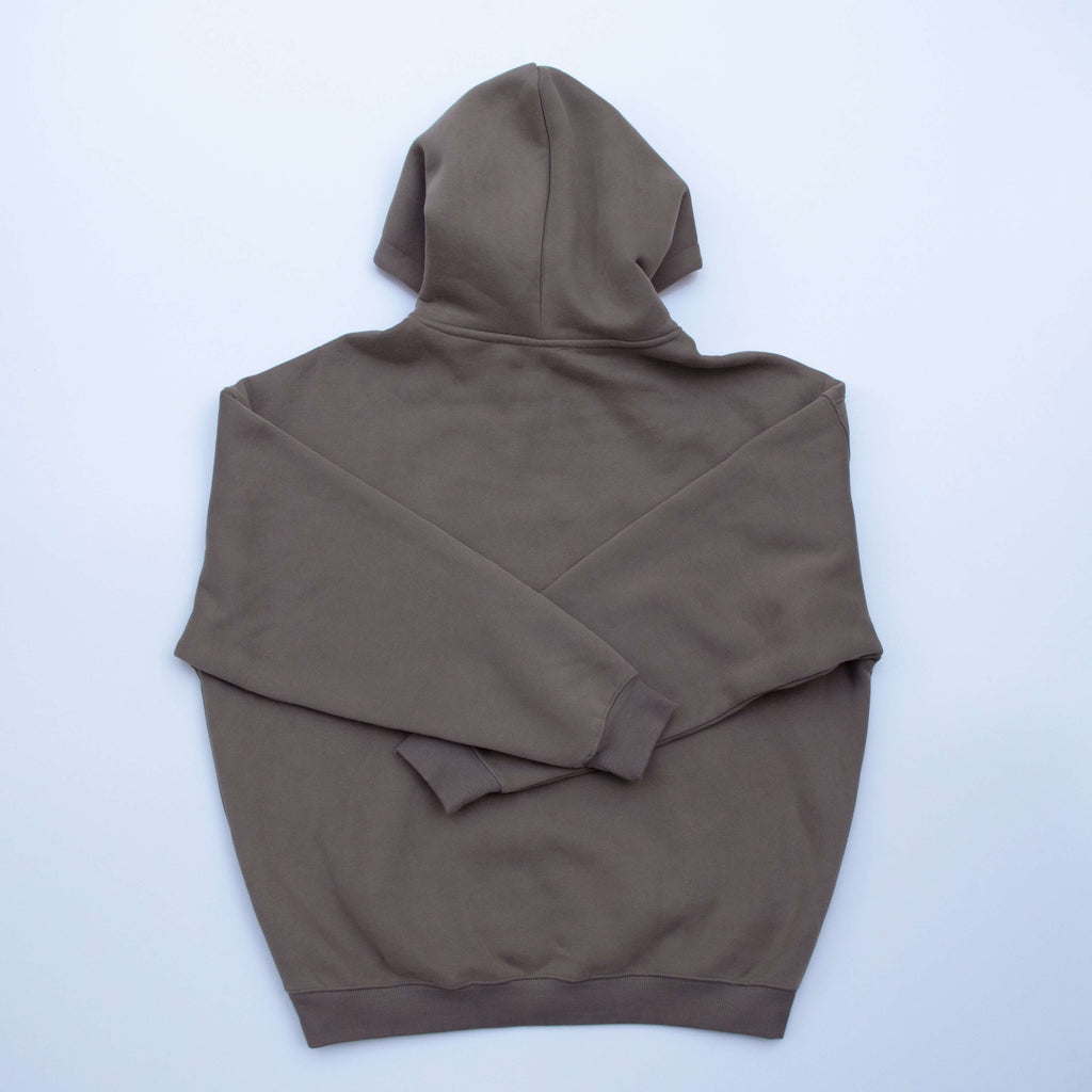 Brown hoodie folded on a white background